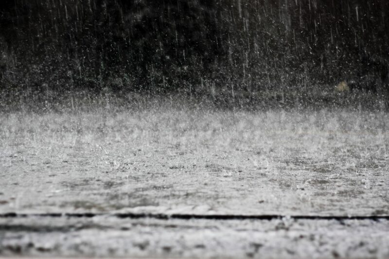 heavy rainfall on a street during a rain storm