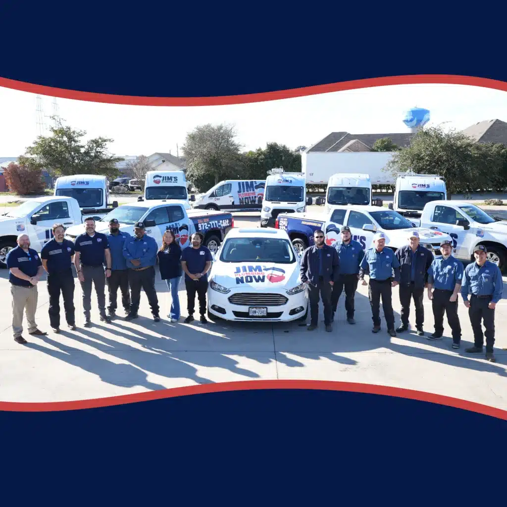 Team of Jim's Plumbing Now standing in front of branded service vehicles