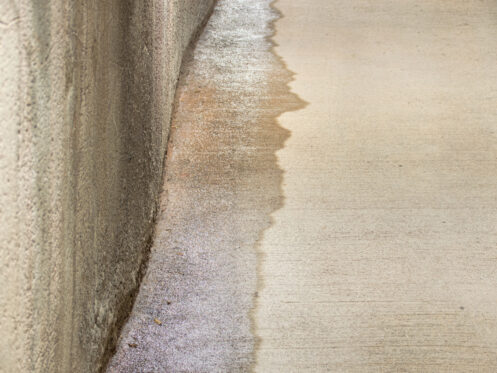 Entrance to a parking lot with entrance of outside water caused by heavy rains