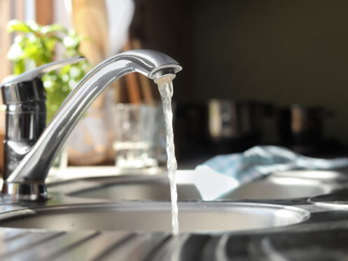 Water running from kitchen sink faucet