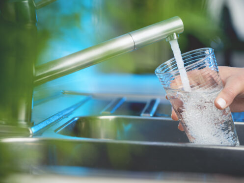 filling glass of water from tap