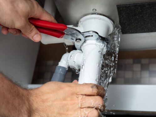 tightening leaking pipe under sink